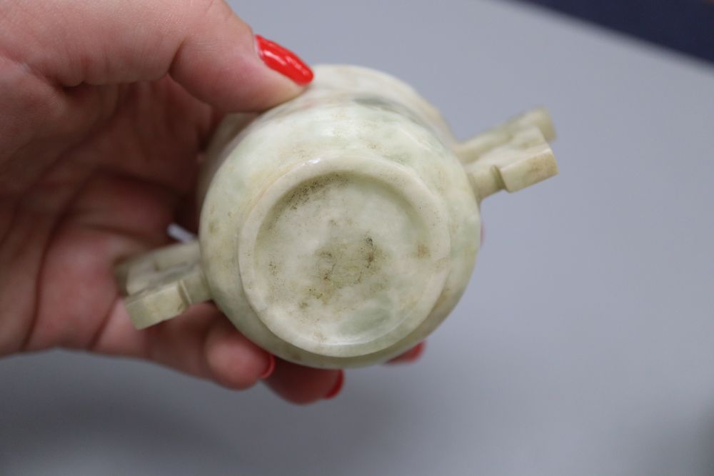 Four Chinese hardstone carvings, one of a gent, a cup and two balls